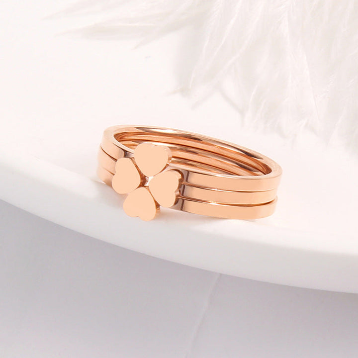 Women's ring with playful heart design and elegant multi-band Nin Boutique