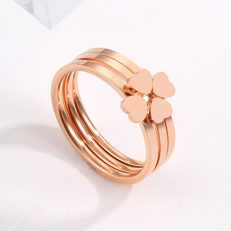 Women's ring with playful heart design and elegant multi-band Nin Boutique