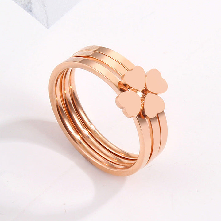 Women's ring with playful heart design and elegant multi-band Nin Boutique