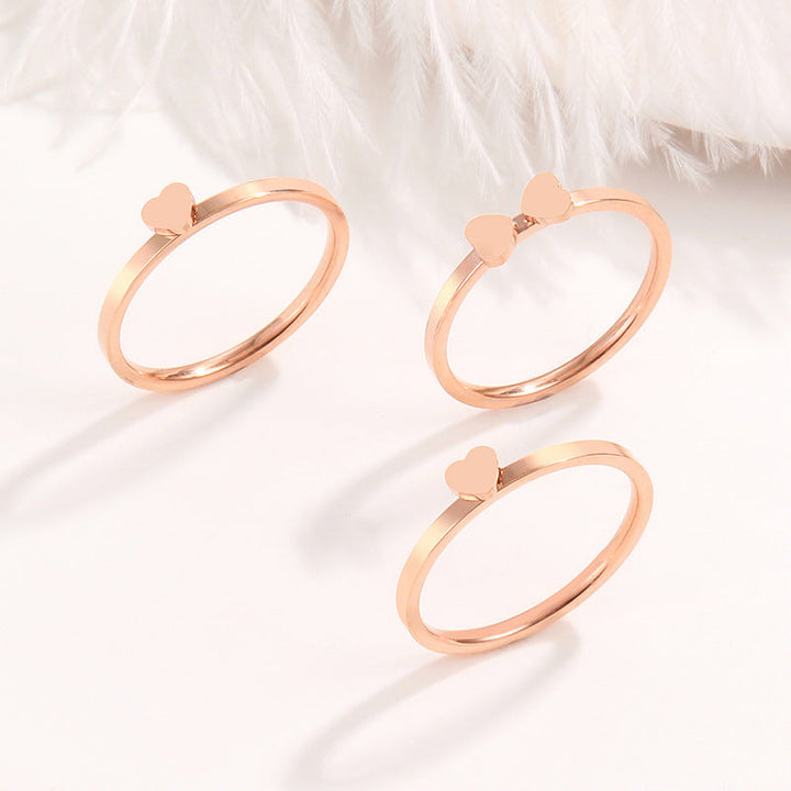 Women's ring with playful heart design and elegant multi-band Nin Boutique