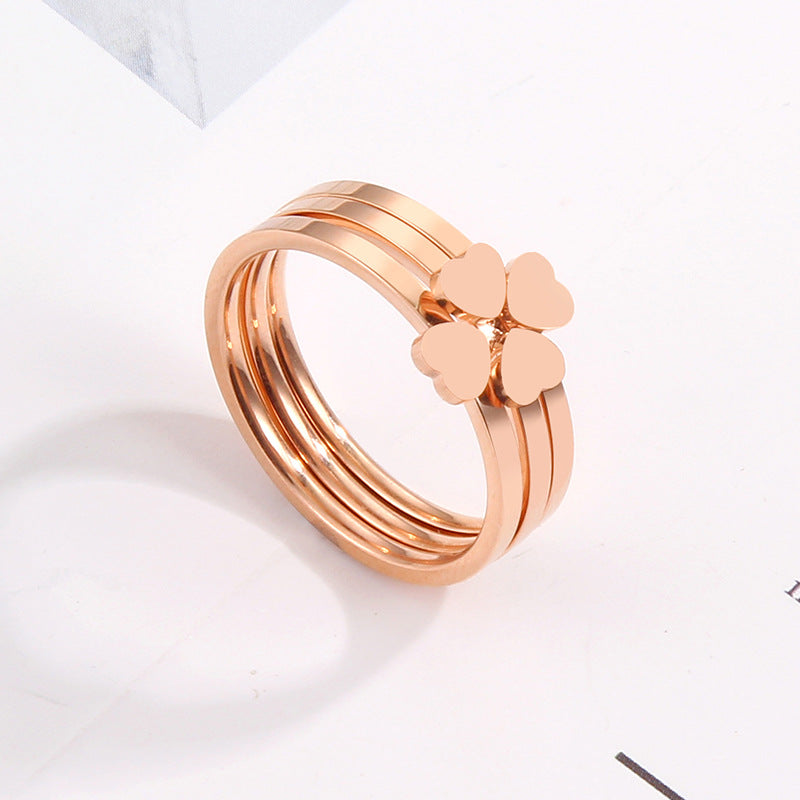 Women's ring with playful heart design and elegant multi-band Nin Boutique