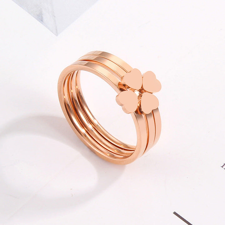 Women's ring with playful heart design and elegant multi-band Nin Boutique