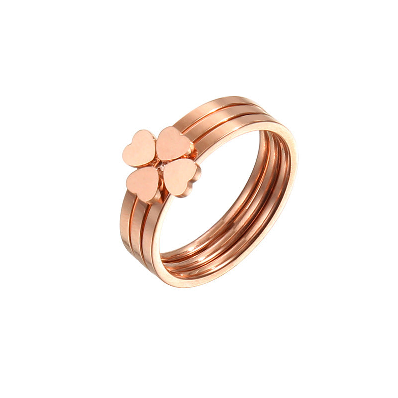 Women's ring with playful heart design and elegant multi-band Nin Boutique