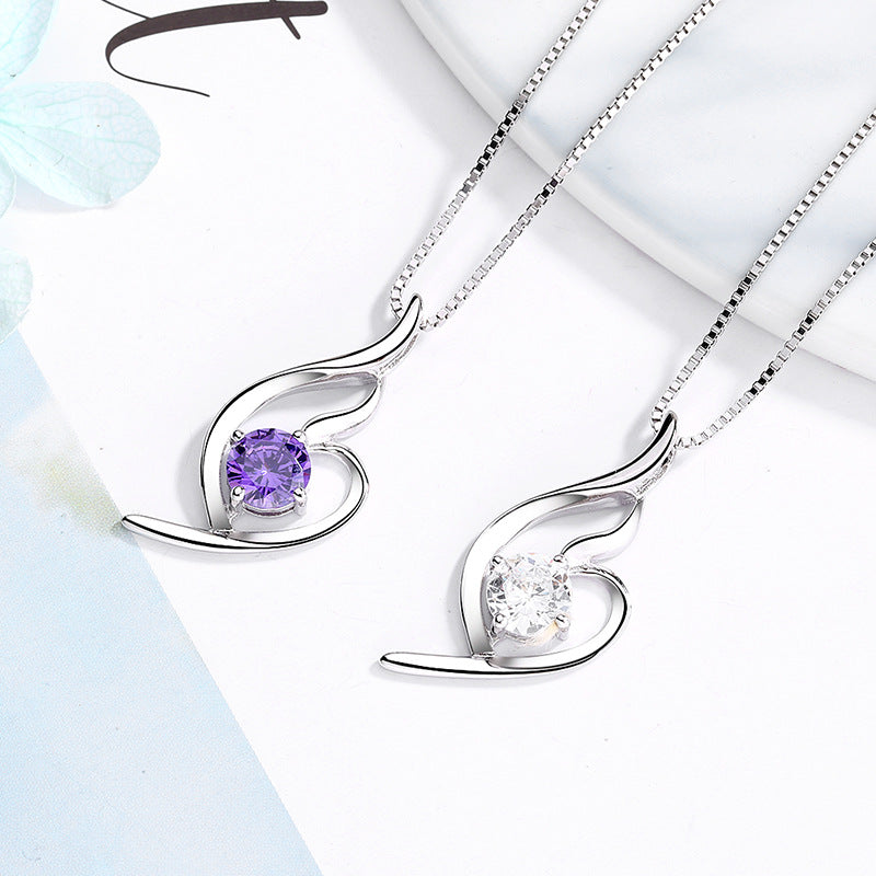 Women's necklace with elegant spiral motif and sparkling purple stone Nin Boutique