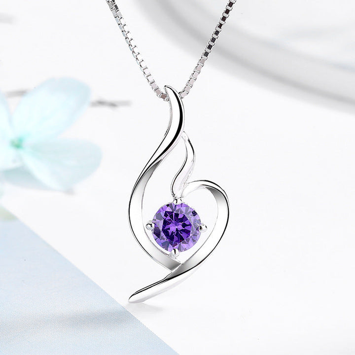 Women's necklace with elegant spiral motif and sparkling purple stone Nin Boutique