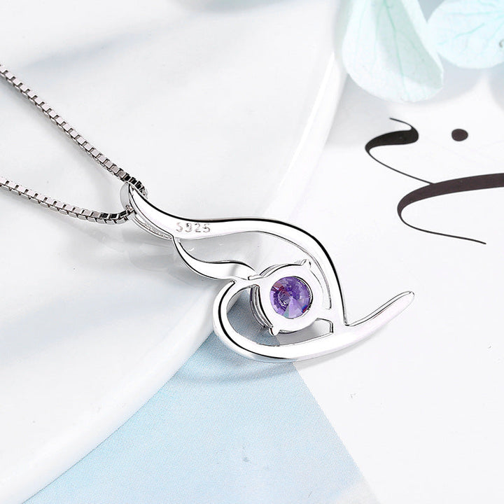 Women's necklace with elegant spiral motif and sparkling purple stone Nin Boutique
