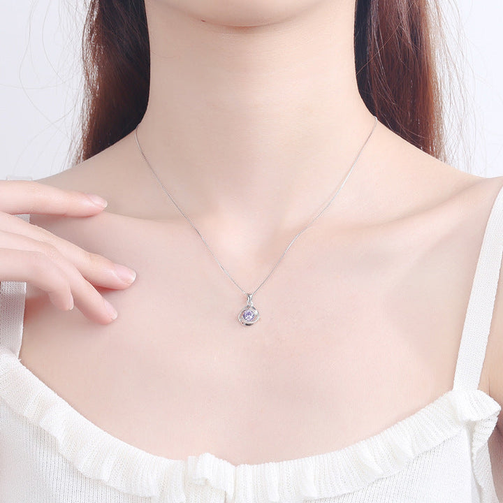 Women's pendant necklace with elegant, spiral design and sparkling purple stone Nin Boutique