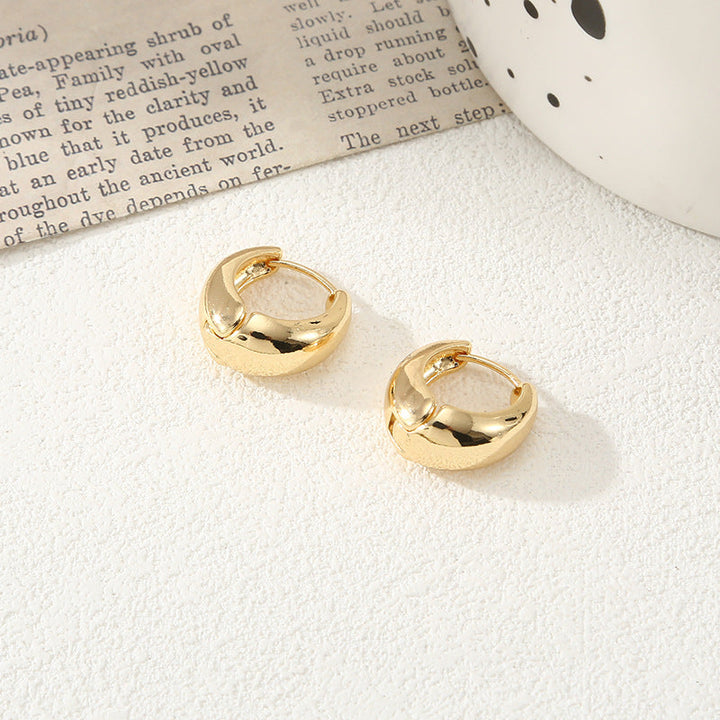 Women's stud earrings in luxurious gold design Nin Boutique