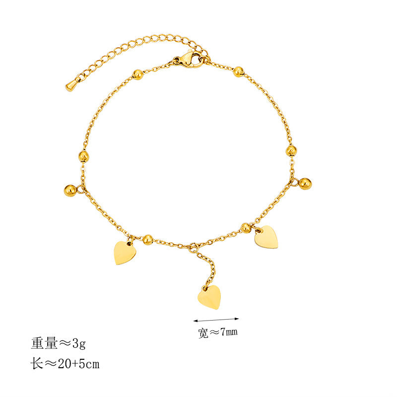 Ladies delicate ankle bracelet with heart-shaped pendants and shiny ball details Nin Boutique