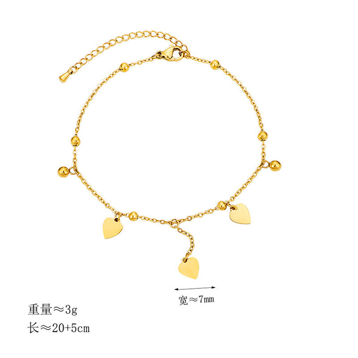 Ladies delicate ankle bracelet with heart-shaped pendants and shiny ball details Nin Boutique