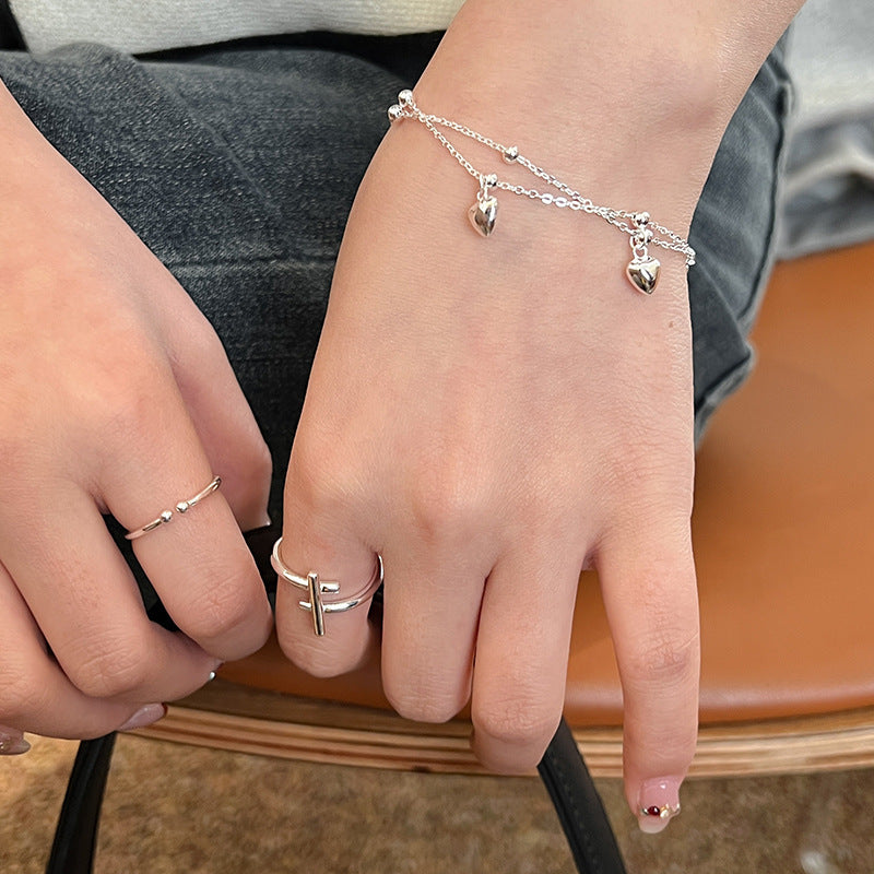 Women's open ring with modern cross design Nin Boutique