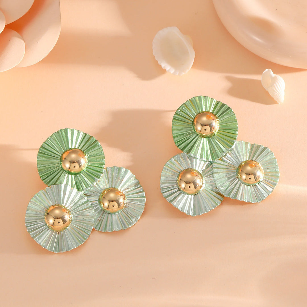 Ladies earrings with intricate fold design and shimmering accents Nin Boutique
