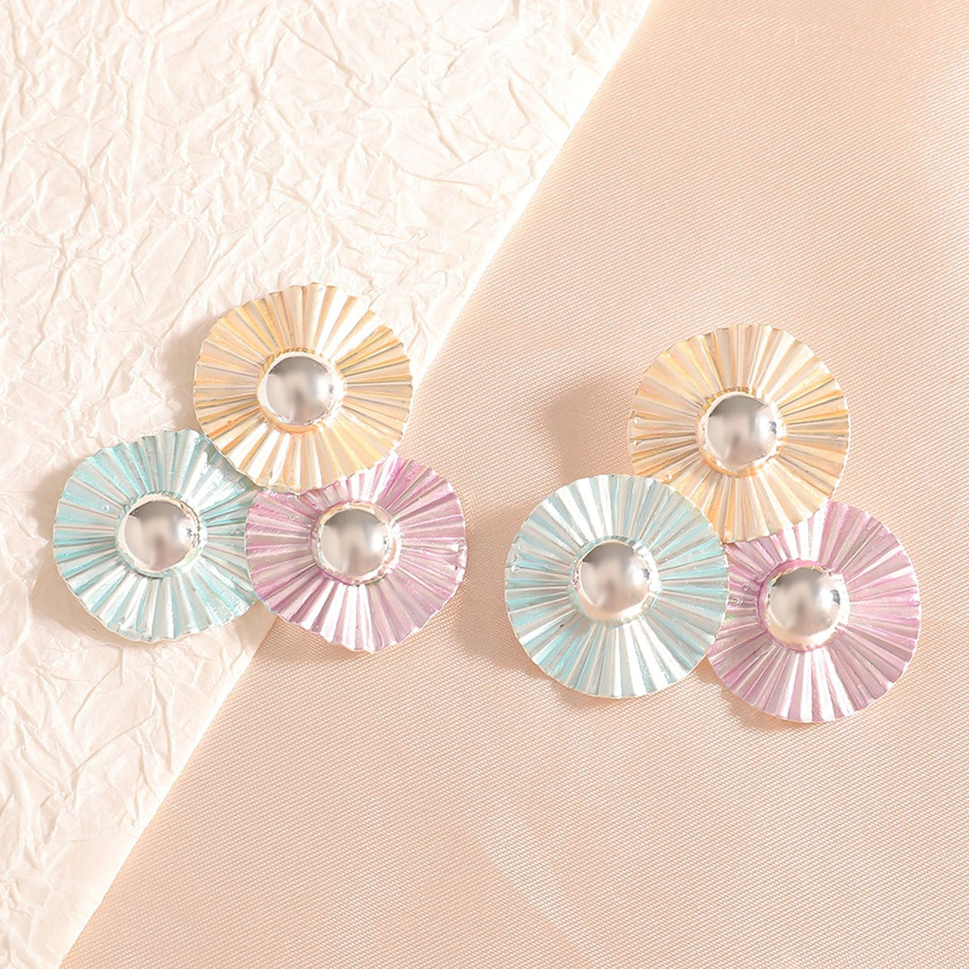 Ladies earrings with intricate fold design and shimmering accents Nin Boutique