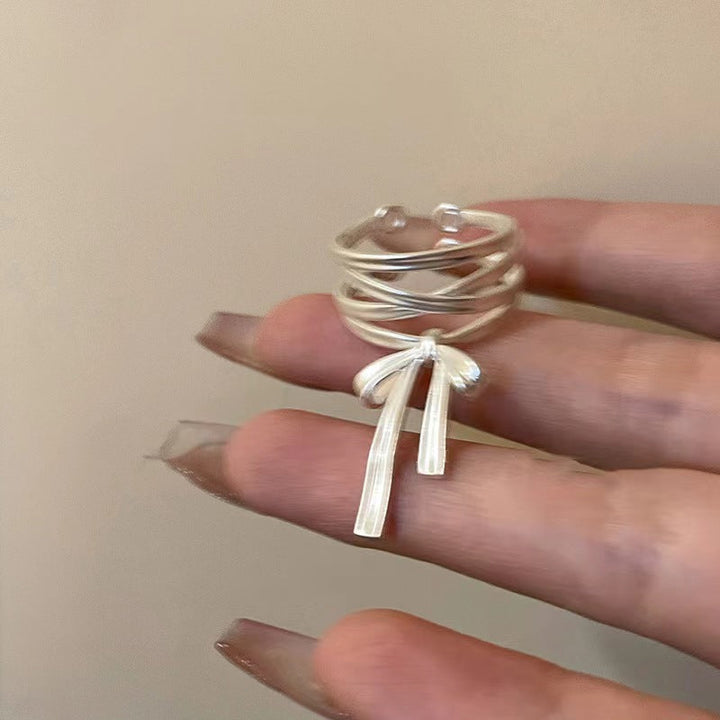 Ladies Open Ring with elaborate band design and elegant bow motif Nin Boutique