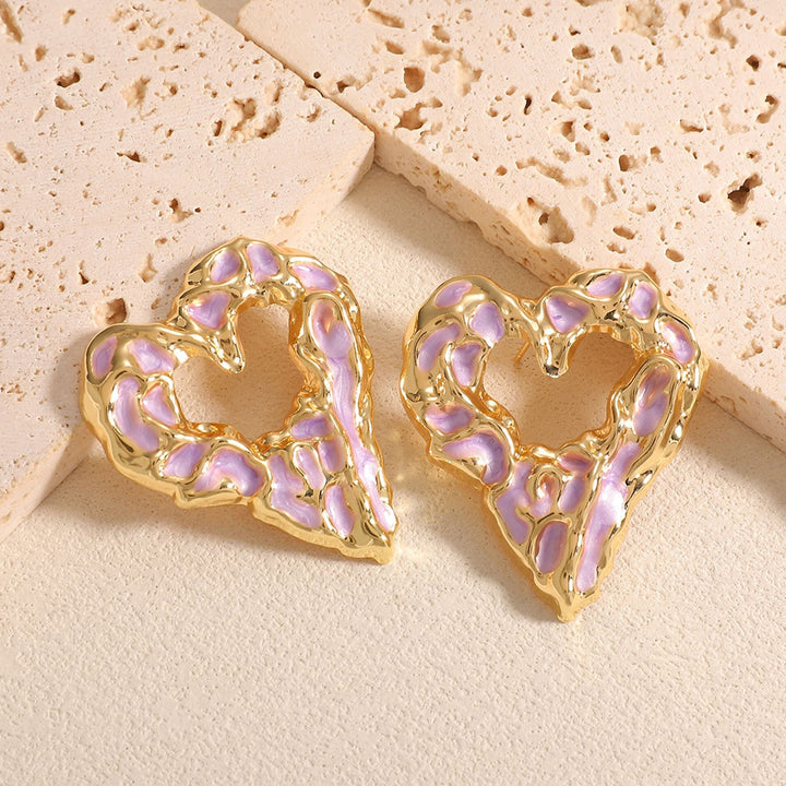 Women’s earrings with unique heart-shaped design and shimmering surface Nin Boutique