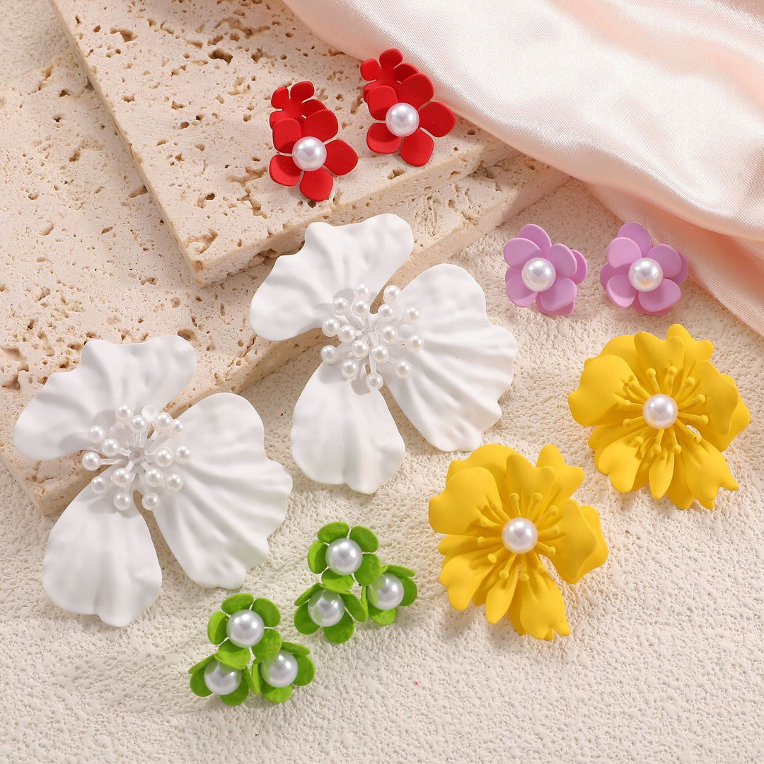 Ladies earrings with playful floral motif and pearl accent Nin Boutique