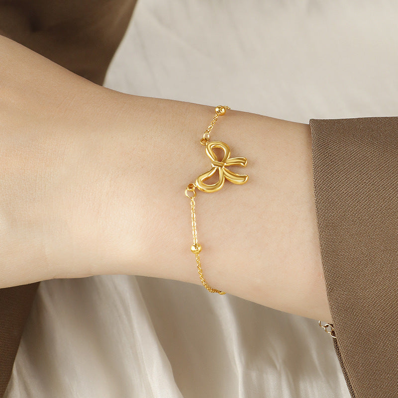 Women's ankle bracelet with delicate bow design and elegant chain layout Nin Boutique