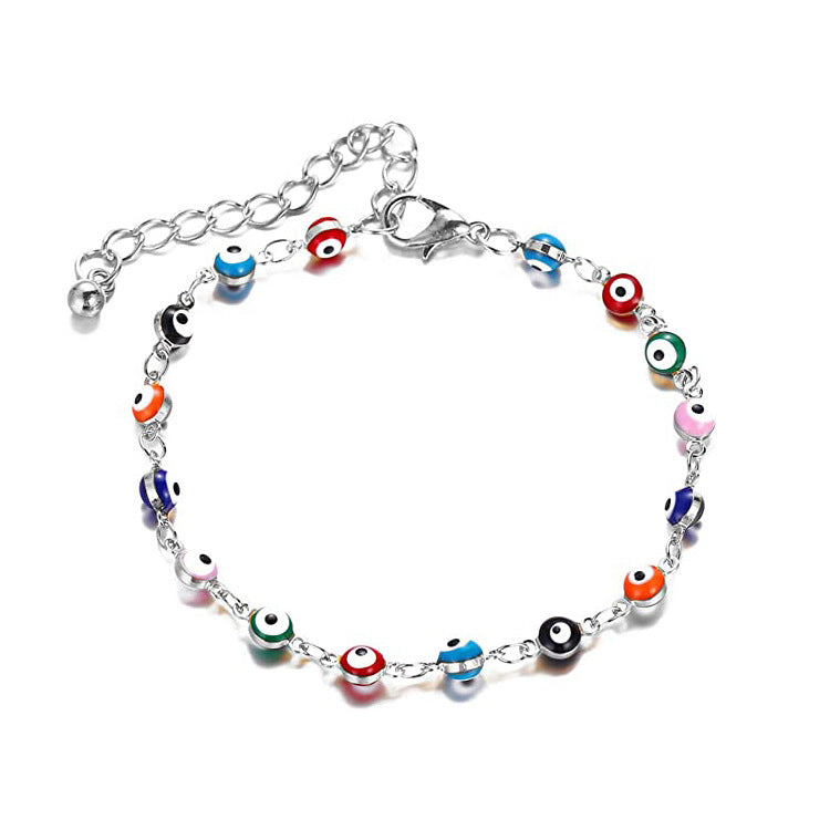 Ladies playful ankle bracelet with colorful glass eyes and delicate design Nin Boutique