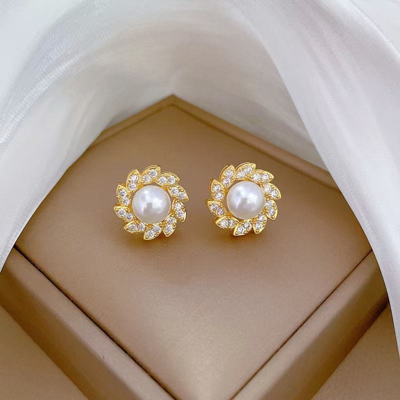 Women's luxury pearl halo cocktail ring with cubic zirconia petal accents and adjustable band Nin Boutique