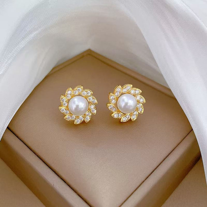 Women's luxury pearl halo cocktail ring with cubic zirconia petal accents and adjustable band Nin Boutique
