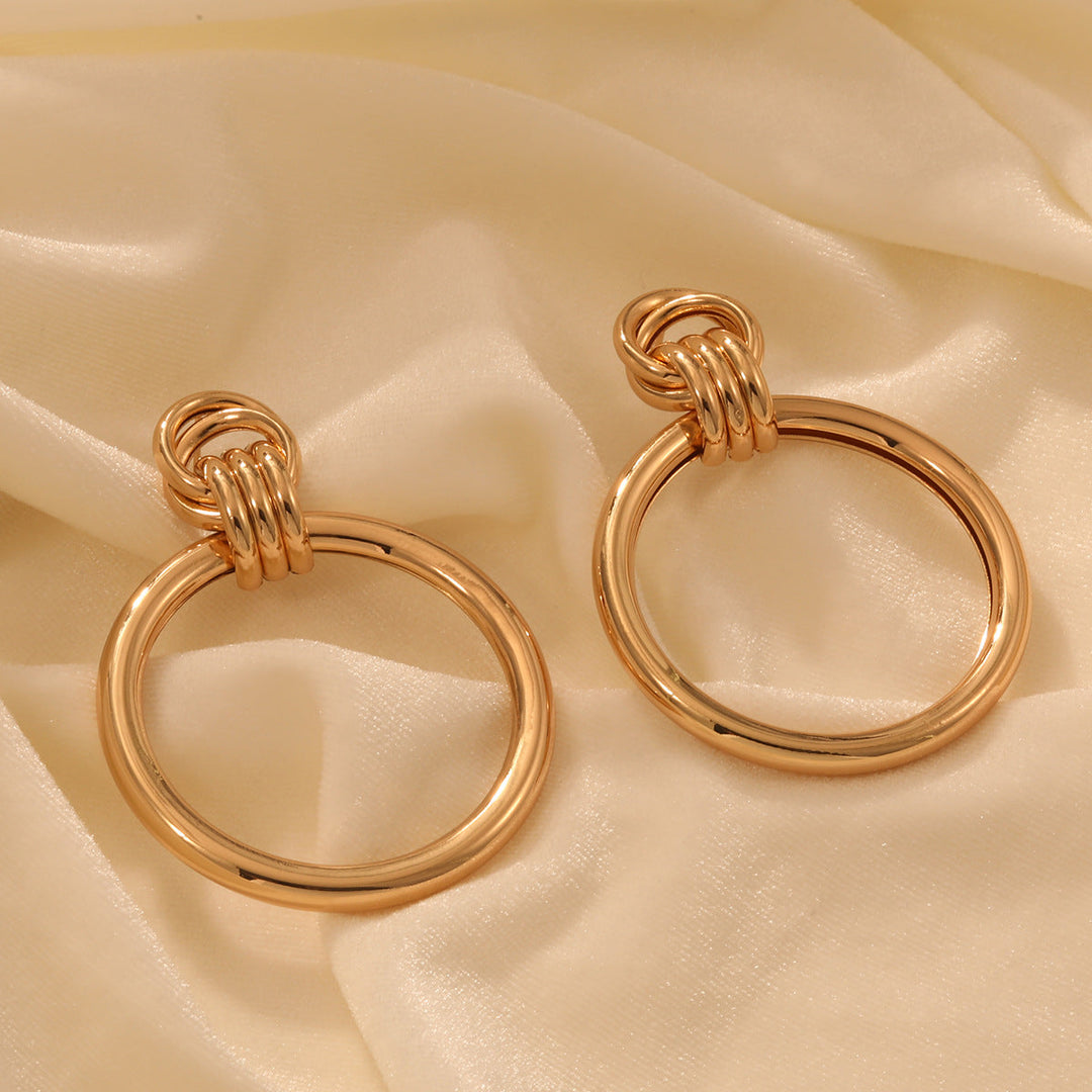 Ladies earrings with modern, curved design Nin Boutique