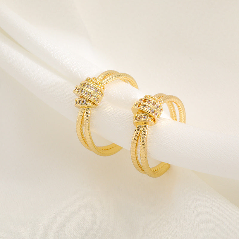 Ladies ring with elaborate, multi-layered design and zirconia appliqués Nin Boutique