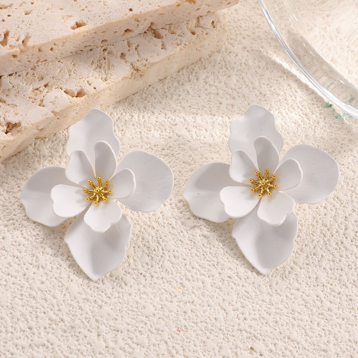 Ladies earrings in artistic floral style with pearl accent Nin Boutique
