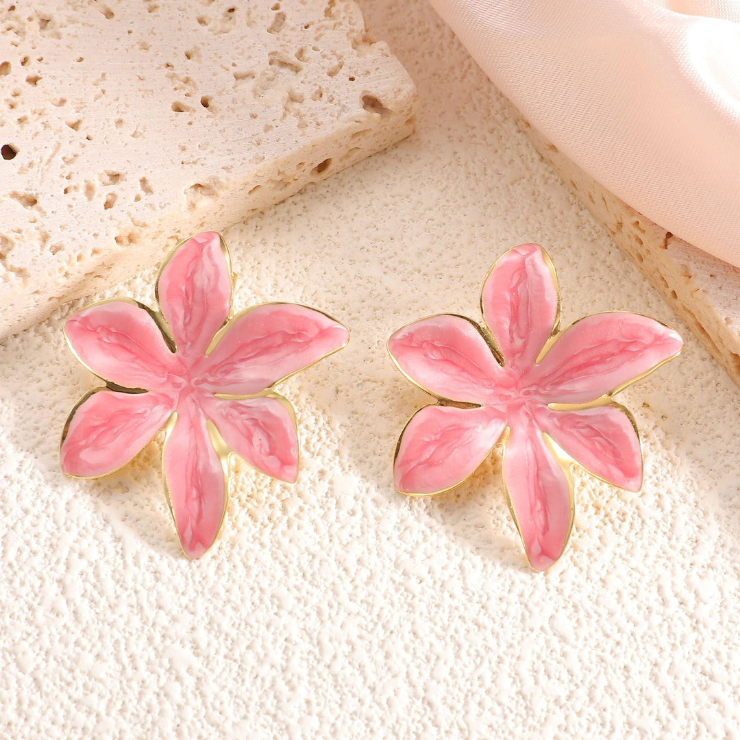 Ladies earrings with floral design and elegant gold rim Nin Boutique