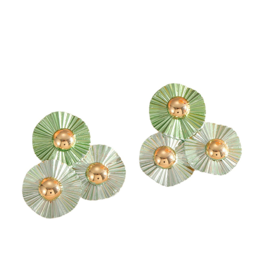 Ladies earrings with intricate fold design and shimmering accents Nin Boutique