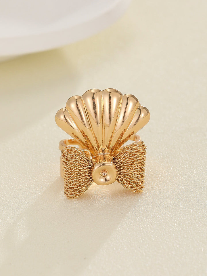 Women's ring with elaborate shell and bow motif Nin Boutique