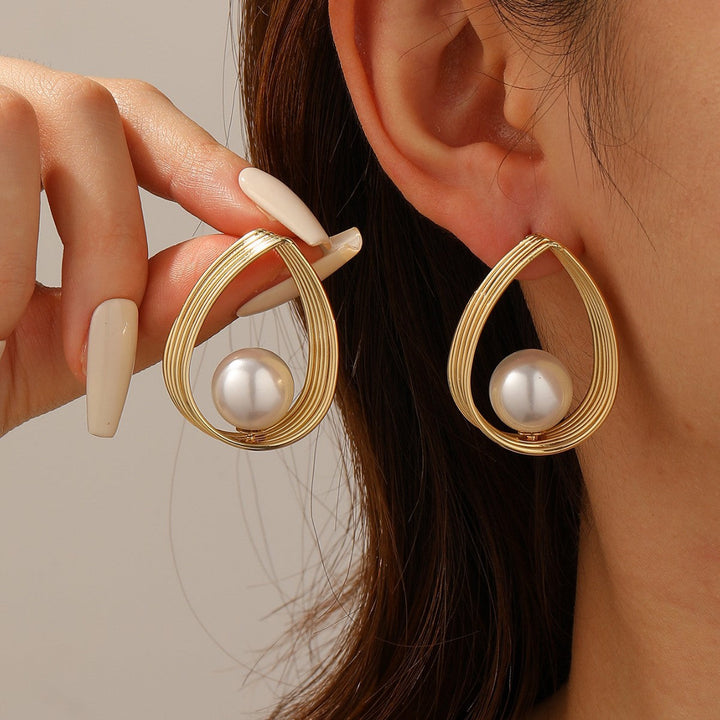 Women's earrings with elegant pearl and geometric shape Nin Boutique
