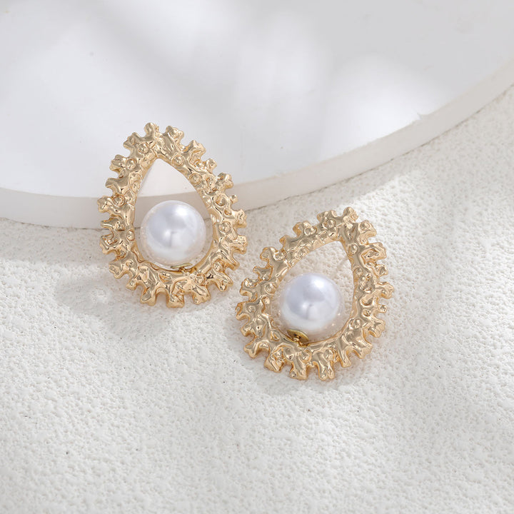 Ladies earrings with heart-shaped design and artificial pearl Nin Boutique