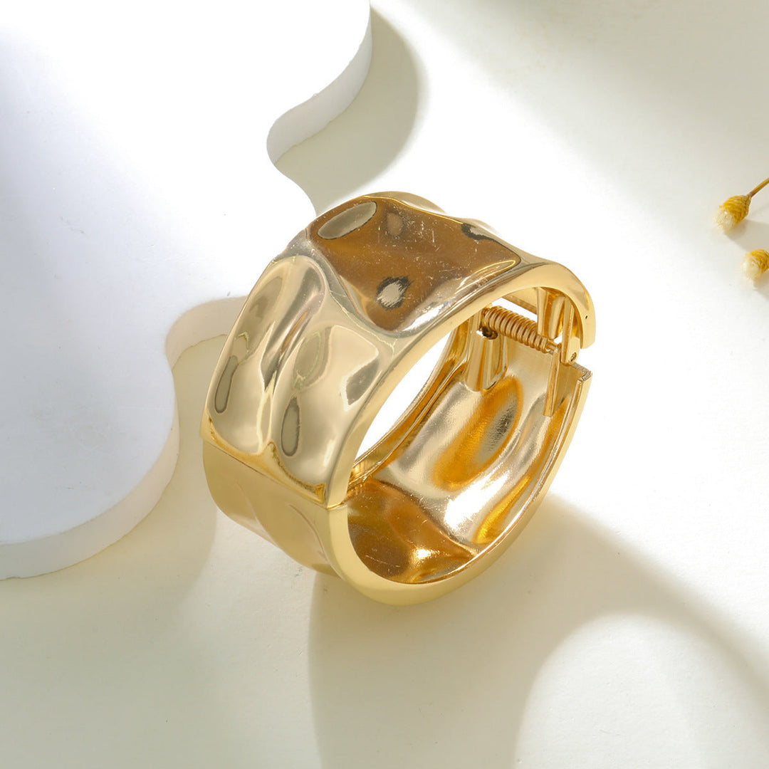 Women's arm cuff in modern, sculptural gold design Nin Boutique