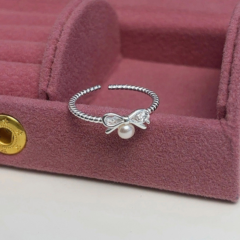 Women's ring with elegant bow and pearl motif Nin Boutique