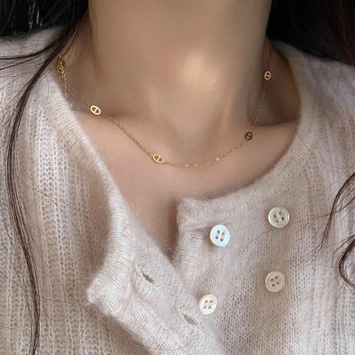 Women's necklace with filigree oval design and modern elements Nin Boutique