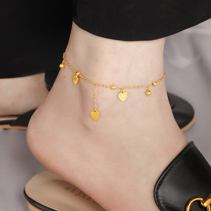 Ladies delicate ankle bracelet with heart-shaped pendants and shiny ball details Nin Boutique