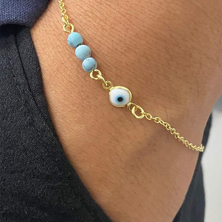 Ladies anklet with protective eye motif and colorful gemstone accents Nin Boutique