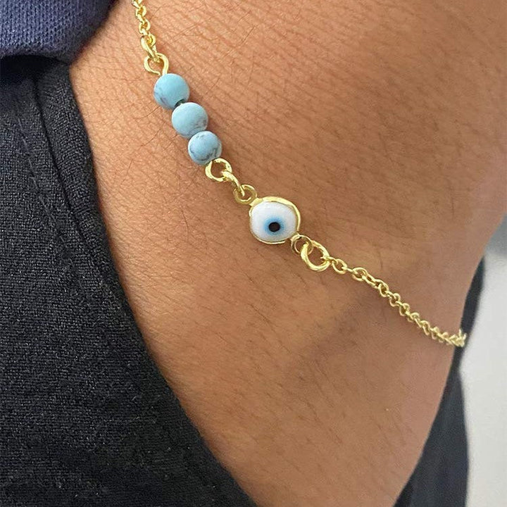 Ladies anklet with protective eye motif and colorful gemstone accents Nin Boutique