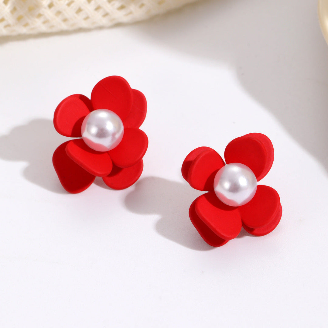 Ladies earrings in vibrant floral design with pearl accent Nin Boutique