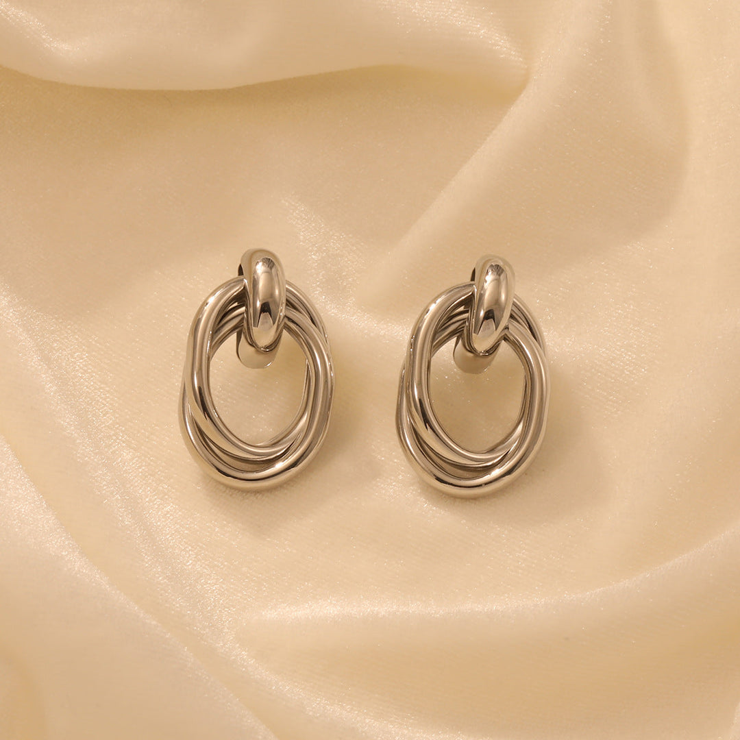 Ladies earrings with modern, curved design Nin Boutique