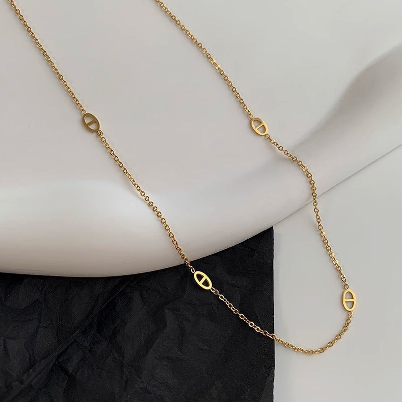 Women's necklace with filigree oval design and modern elements Nin Boutique