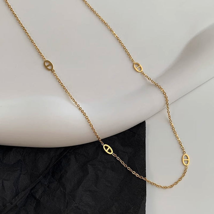 Women's necklace with filigree oval design and modern elements Nin Boutique