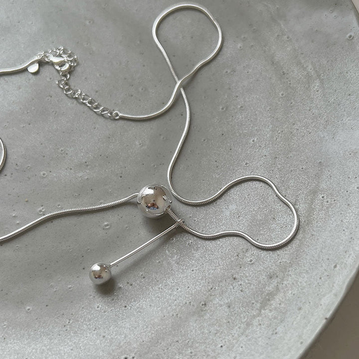 Women's necklace with modern, minimalist design and unique ball details Nin Boutique