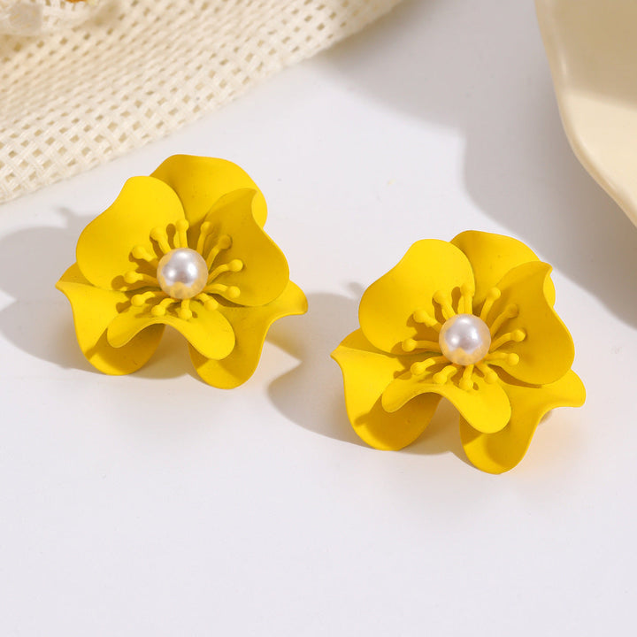 Women's earrings with intricate floral design and pearl accent Nin Boutique