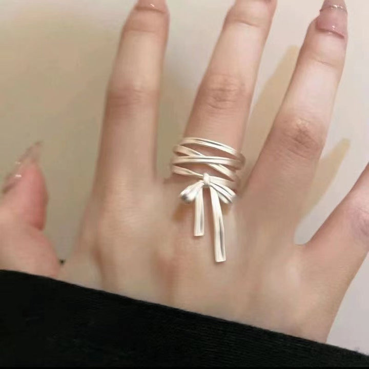 Ladies Open Ring with elaborate band design and elegant bow motif Nin Boutique