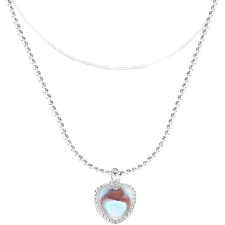 Women's necklace with playful heart pendant and floral detail Nin Boutique