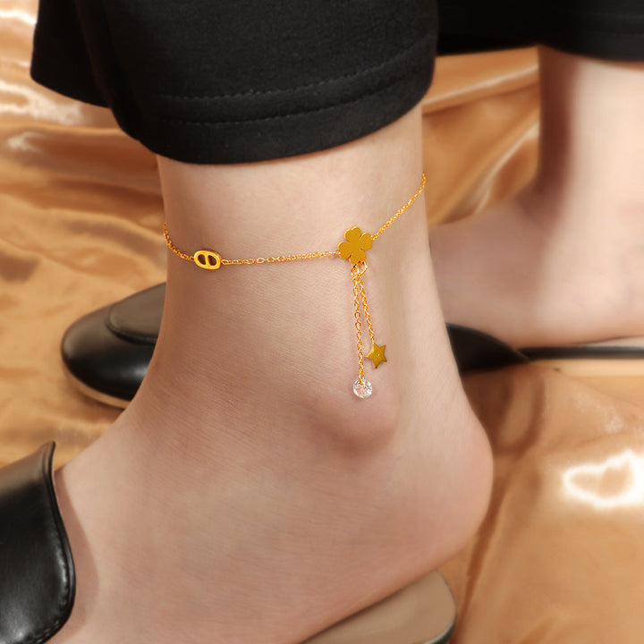 Women's ankle bracelet with delicate lucky flower design and sparkling pendant Nin Boutique