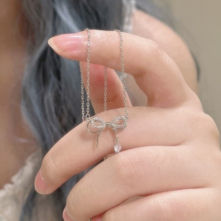 Women's necklace with intricate bow pendant and sparkling zirconia Nin Boutique