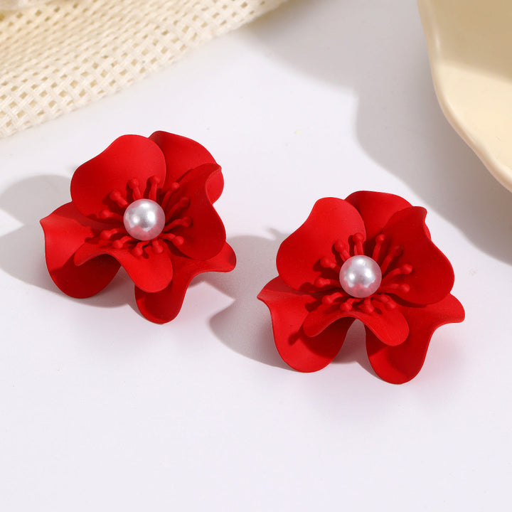 Women's earrings with intricate floral design and pearl accent Nin Boutique
