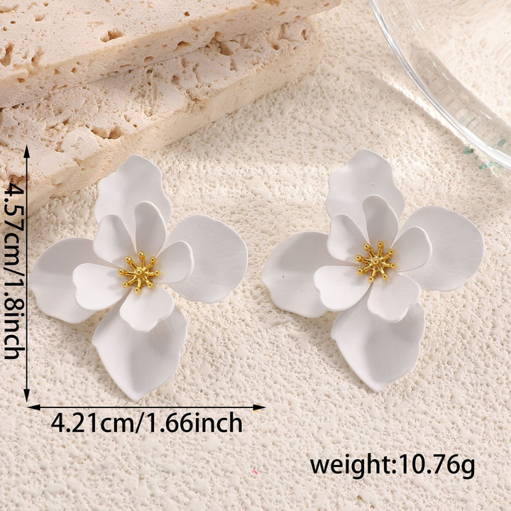 Ladies earrings in artistic floral style with pearl accent Nin Boutique